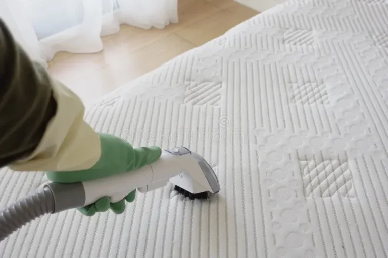 Steam cleaning a mattress to remove stains and allergens