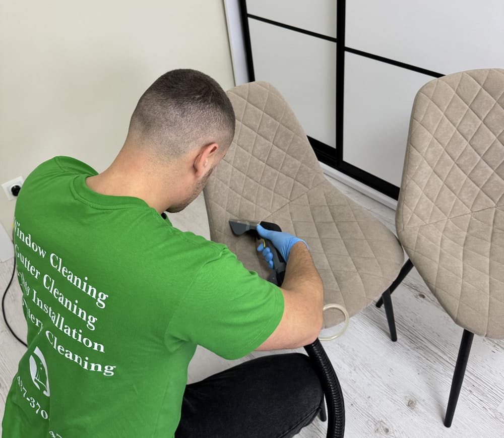 Zenvy technician deep-cleaning with a professional steam extraction tool