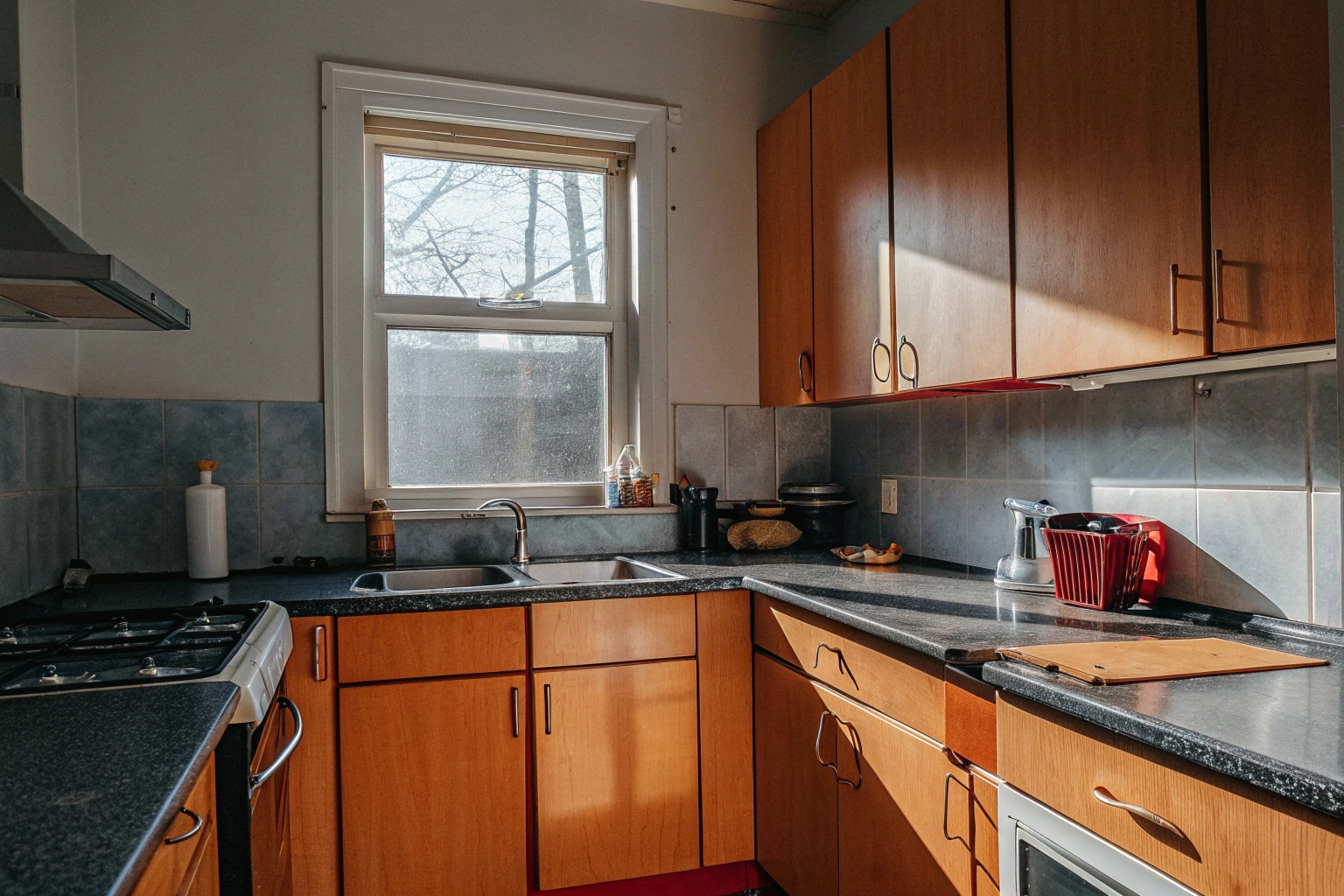 Kitchen after heavy duty deep cleaning with clean cabinets and grease-free surfaces in Toronto apartment