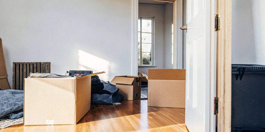 Mostly empty Toronto apartment during move-in, reflecting life transition and tenant change
