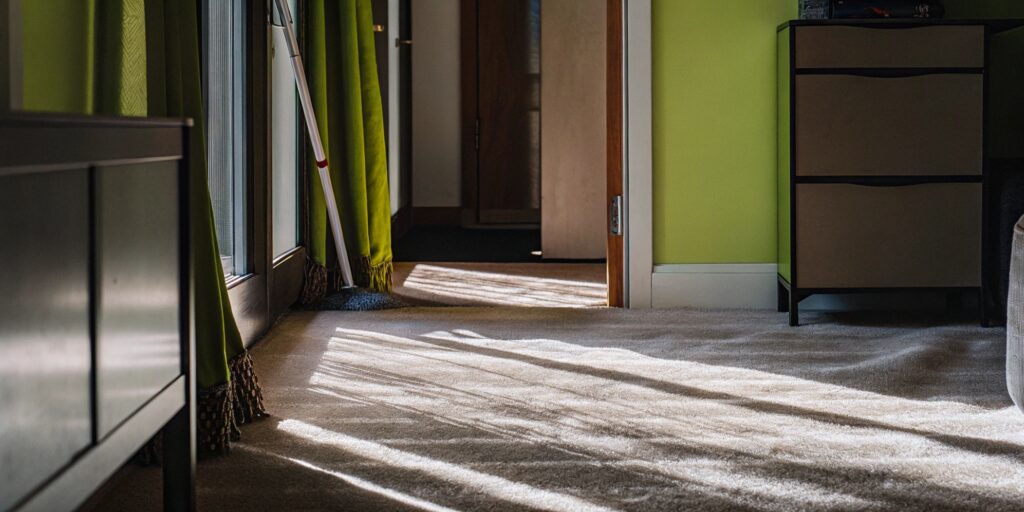 Carpet stain returning in the same spot in a Toronto apartment hallway