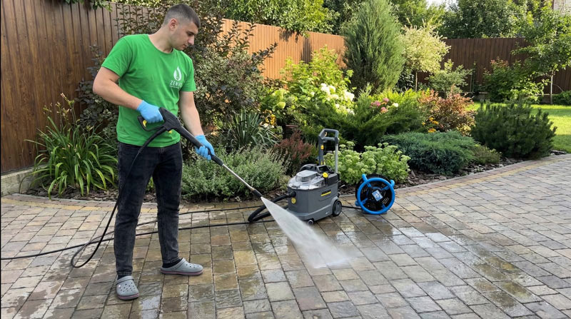 Zenvy cleaner power washing interlock paver patio in Toronto backyard