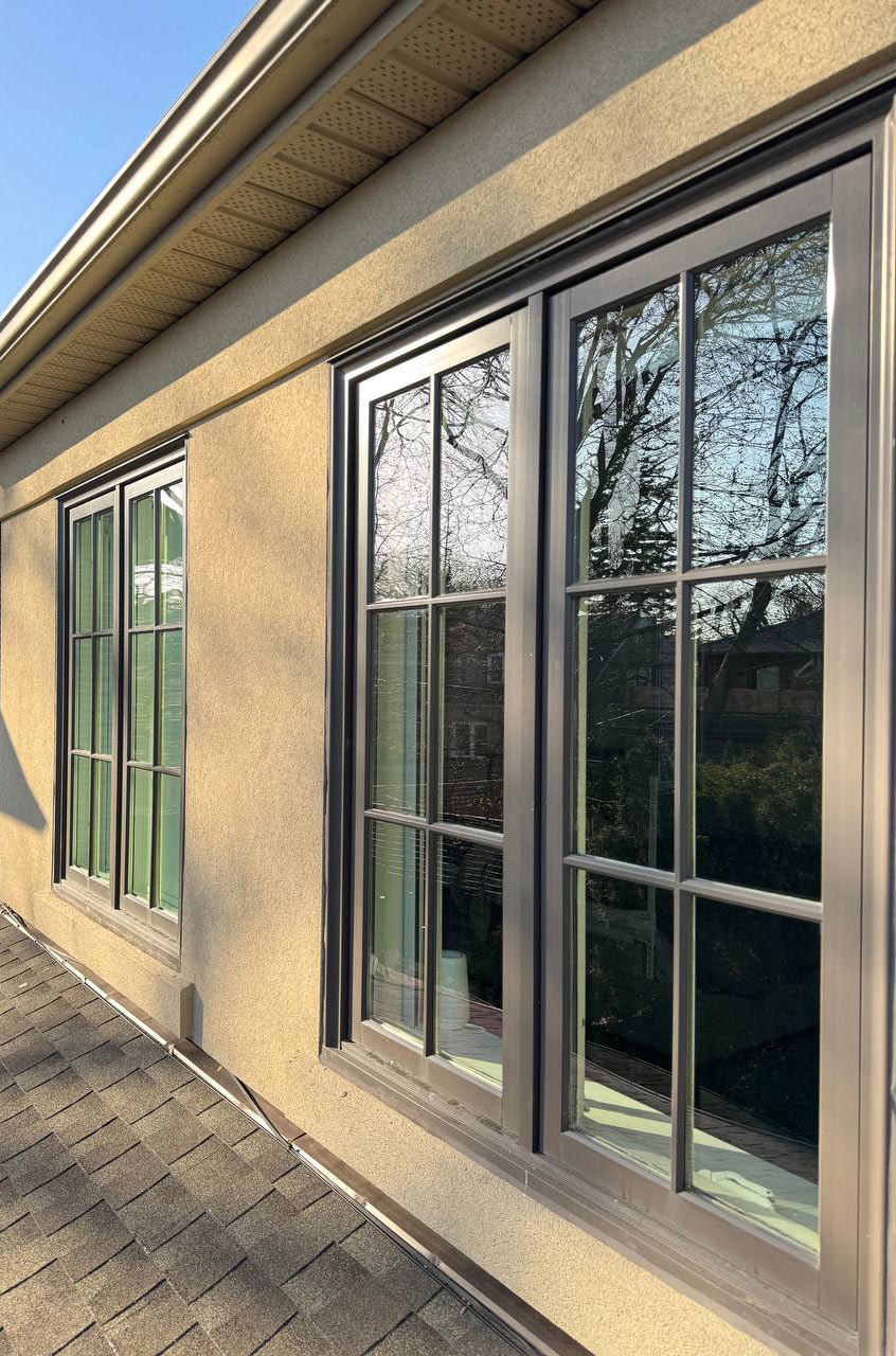 Zenvy cleaner removing hard water stains from exterior window using microfiber cloth and spray solution