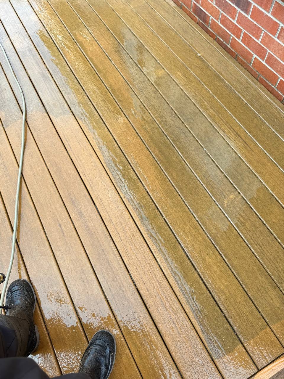 Power washing an interlock driveway in the GTA, half cleaned